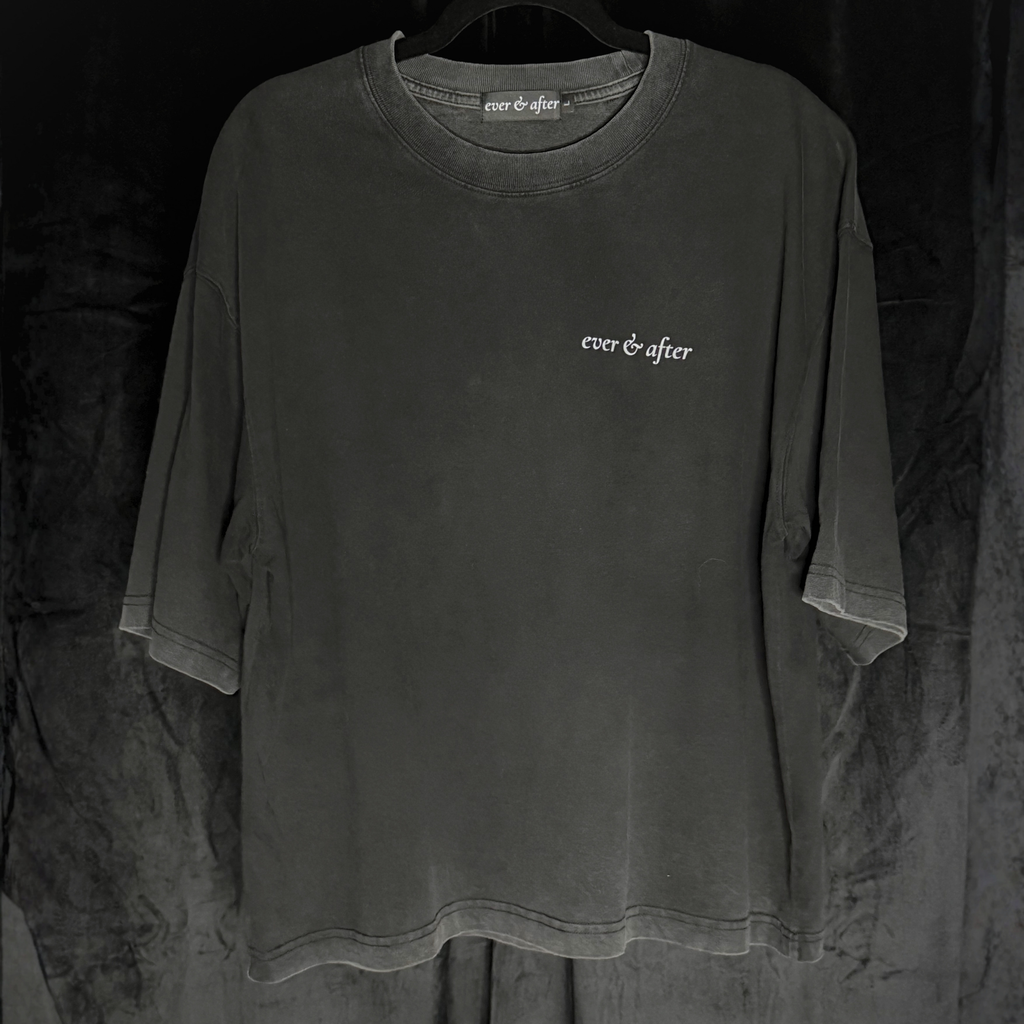 Dark gray t-shirt with 'ever & after' logo on a hanger against a dark background