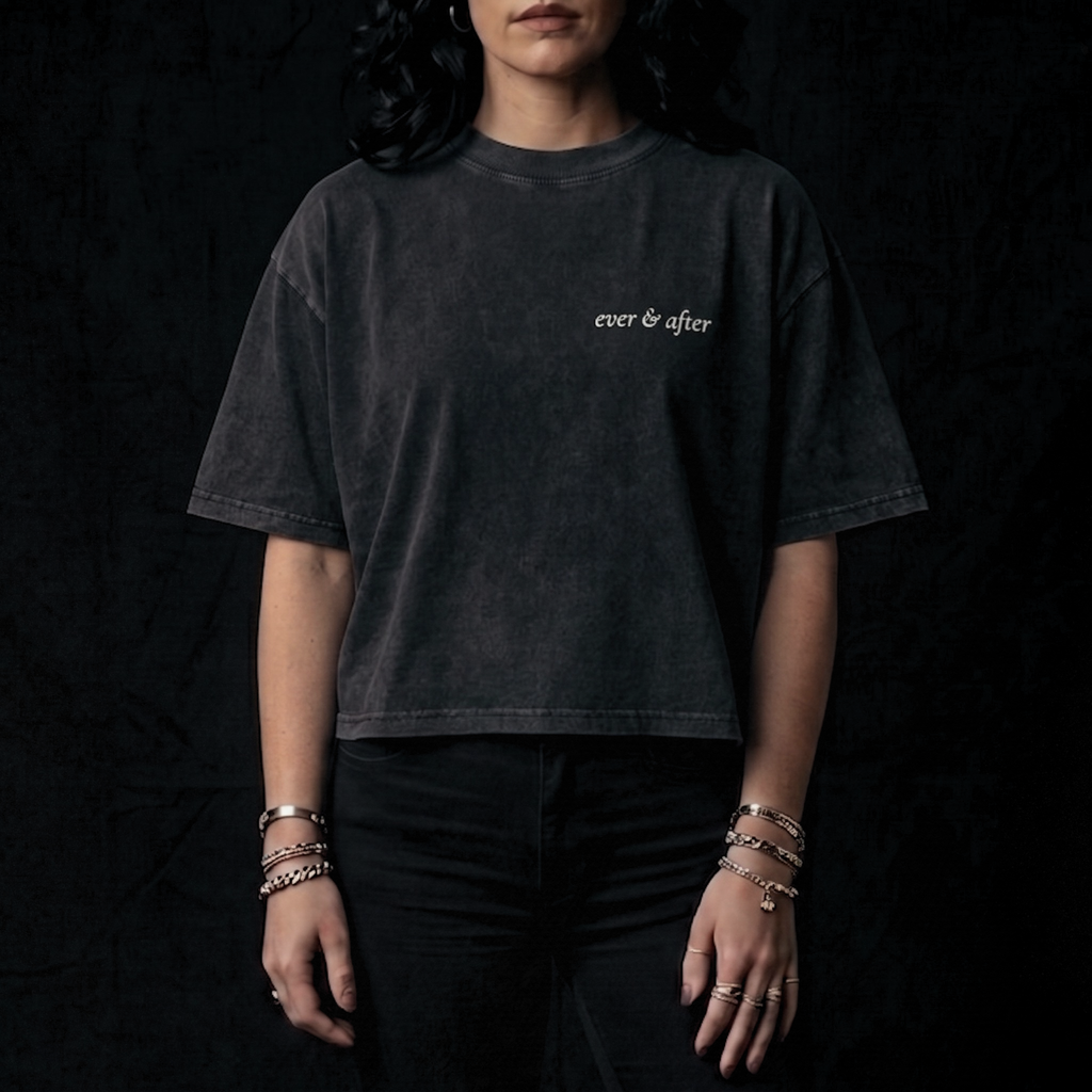 Person wearing a black t-shirt with 'ever & after' text on a dark background