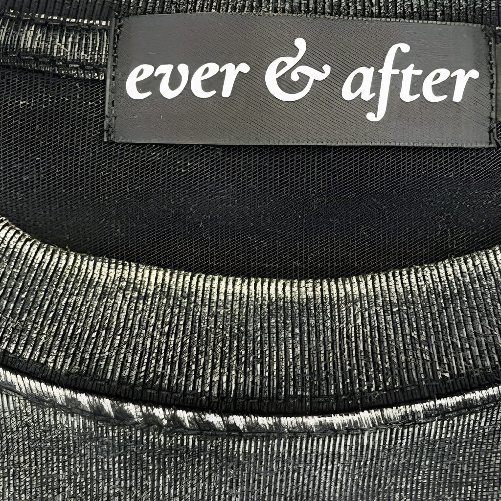 Close-up of a black fabric with 'ever & after' label.