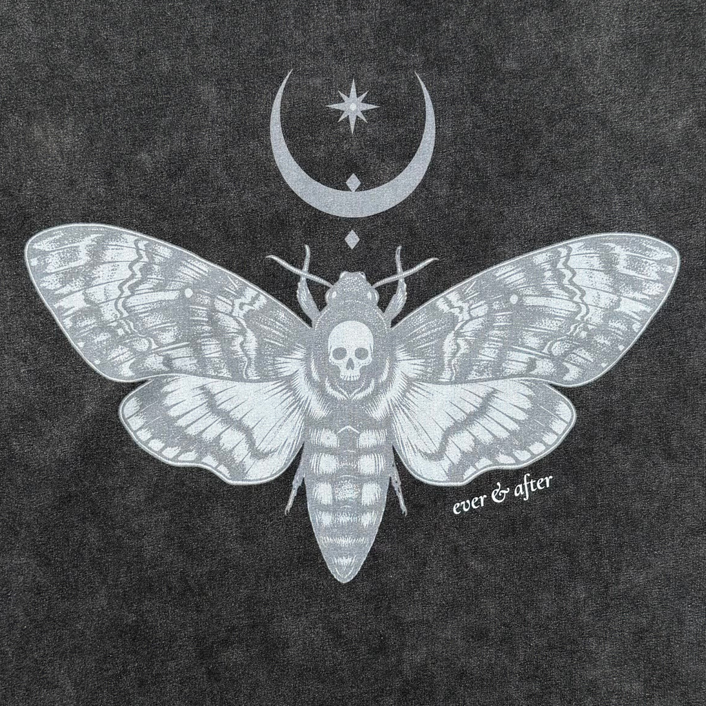 A dark charcoal gray textured background featuring a detailed silver-gray illustration of a moth with a skull in its abdomen, a crescent moon and star above, and the text 'ever & after' near the lower right.