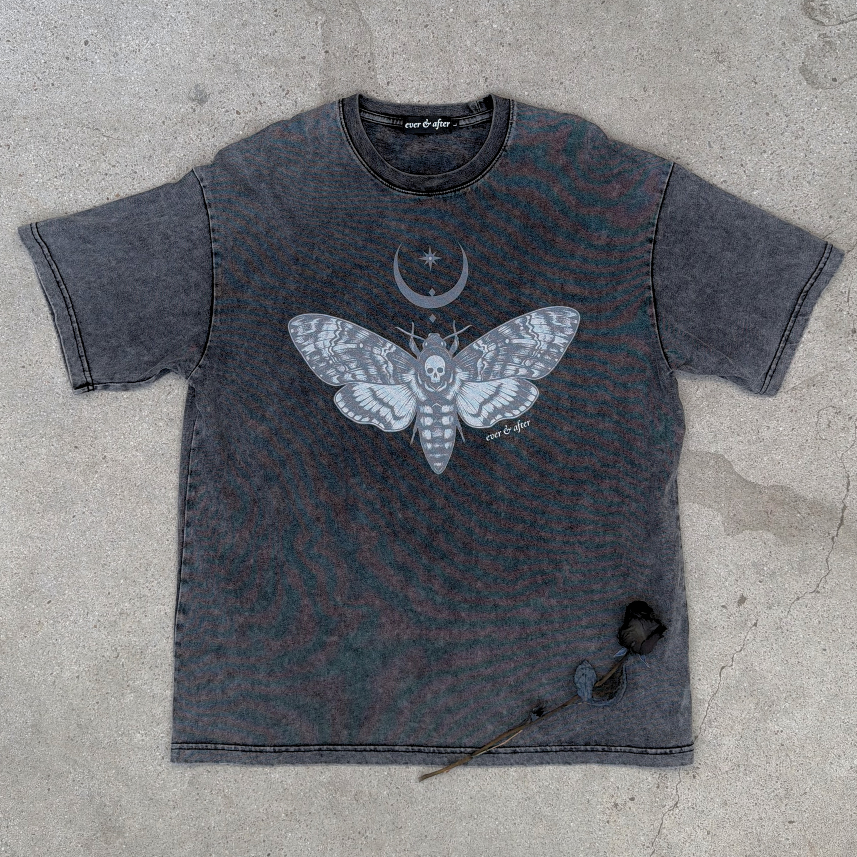 gothic stone oversized tee layflat on concrete with rose
