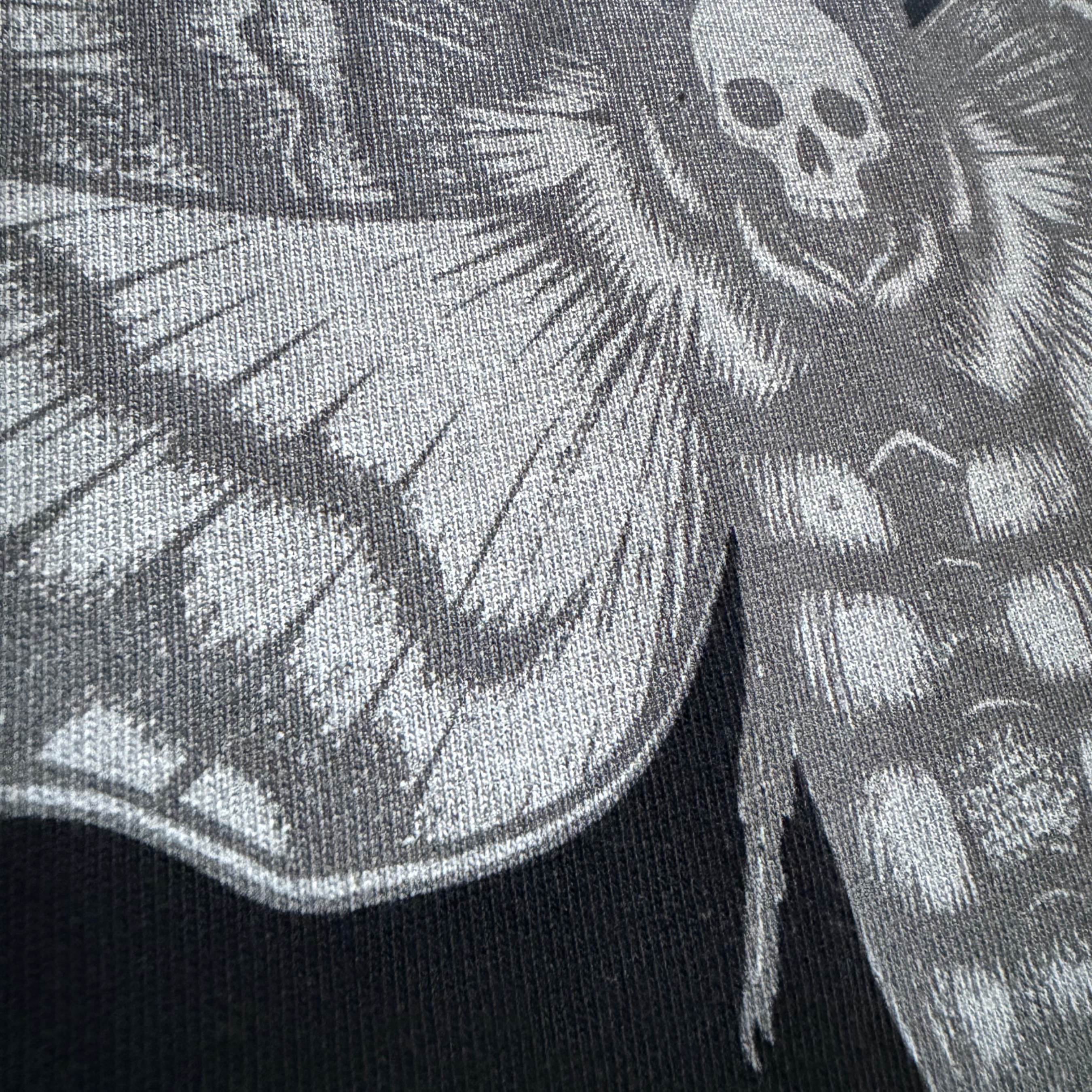 Close-up of a black and gray patterned fabric with a skull design.