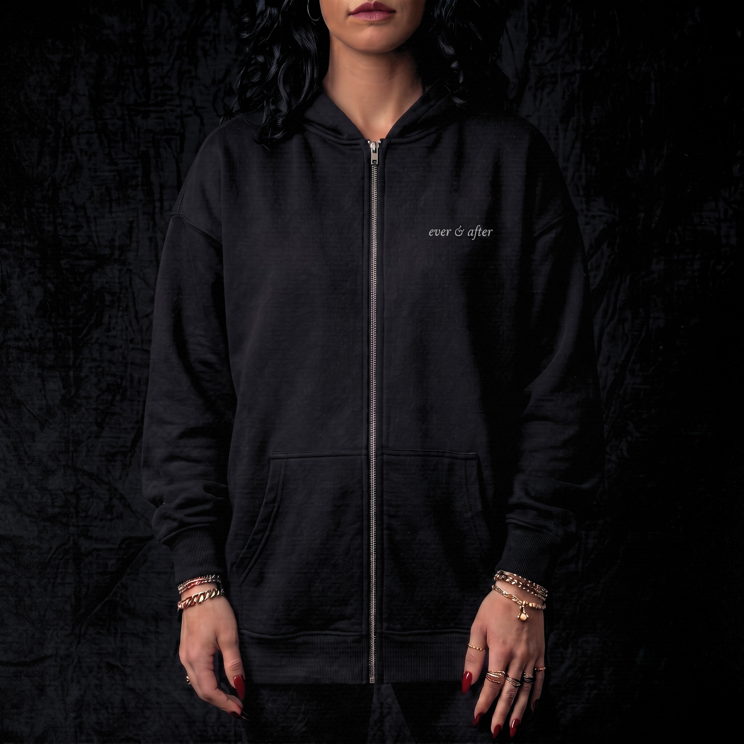 Person wearing a black hoodie with 'ever & after' branding on a dark background
