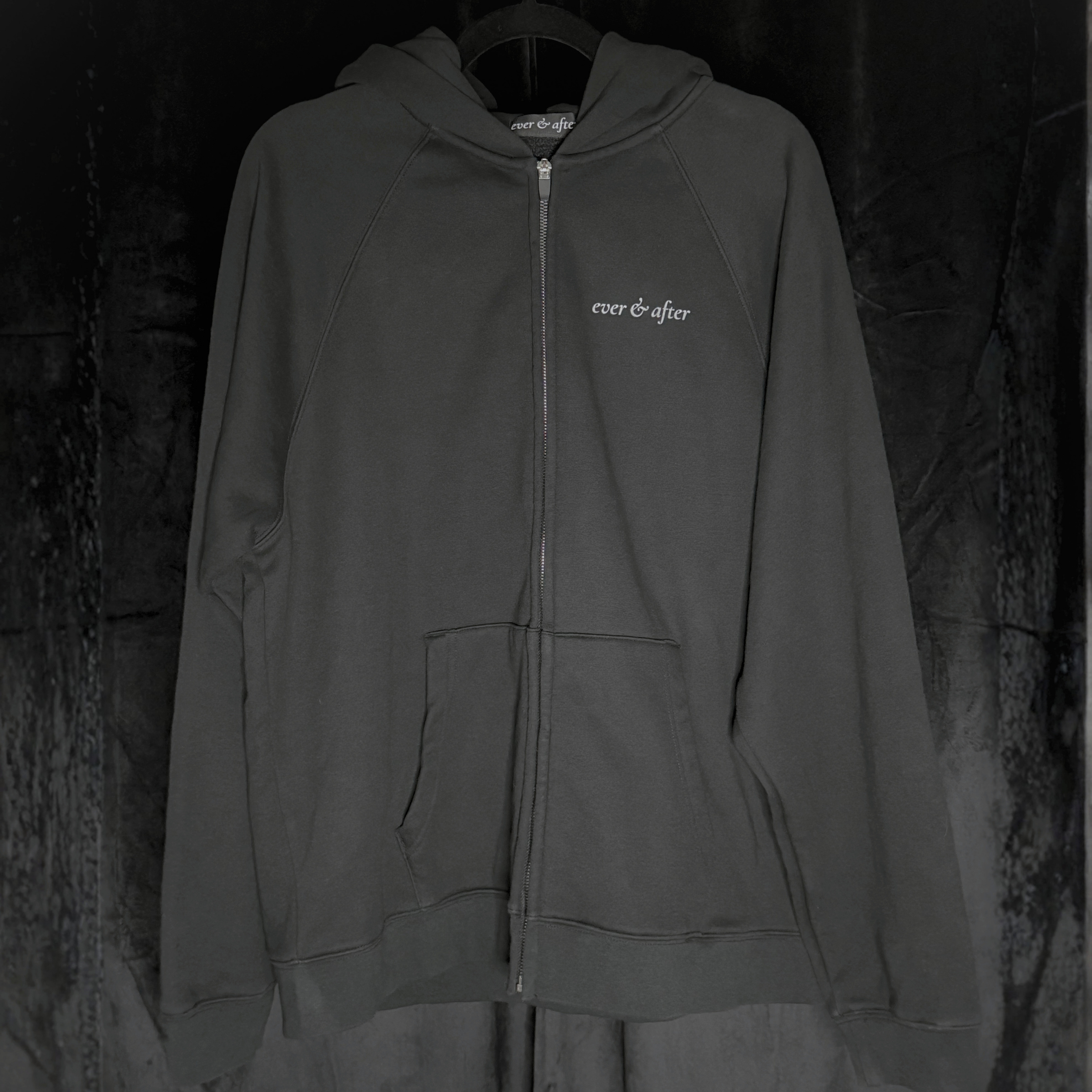 Dark gray hoodie with 'ever & after' logo on a textured black background