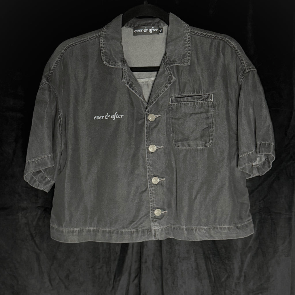 Dark denim jacket with 'ever & after' branding on a black background