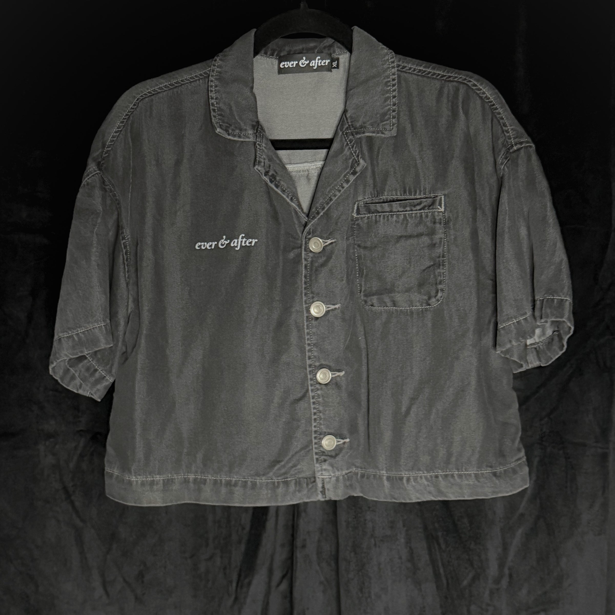 Dark denim jacket with 'ever & after' branding on a black background