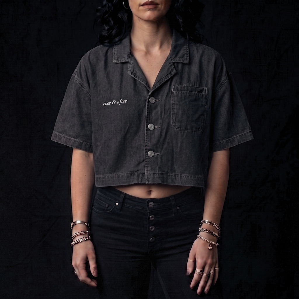 Person wearing a dark denim shirt with 'ever & after' branding on a black background